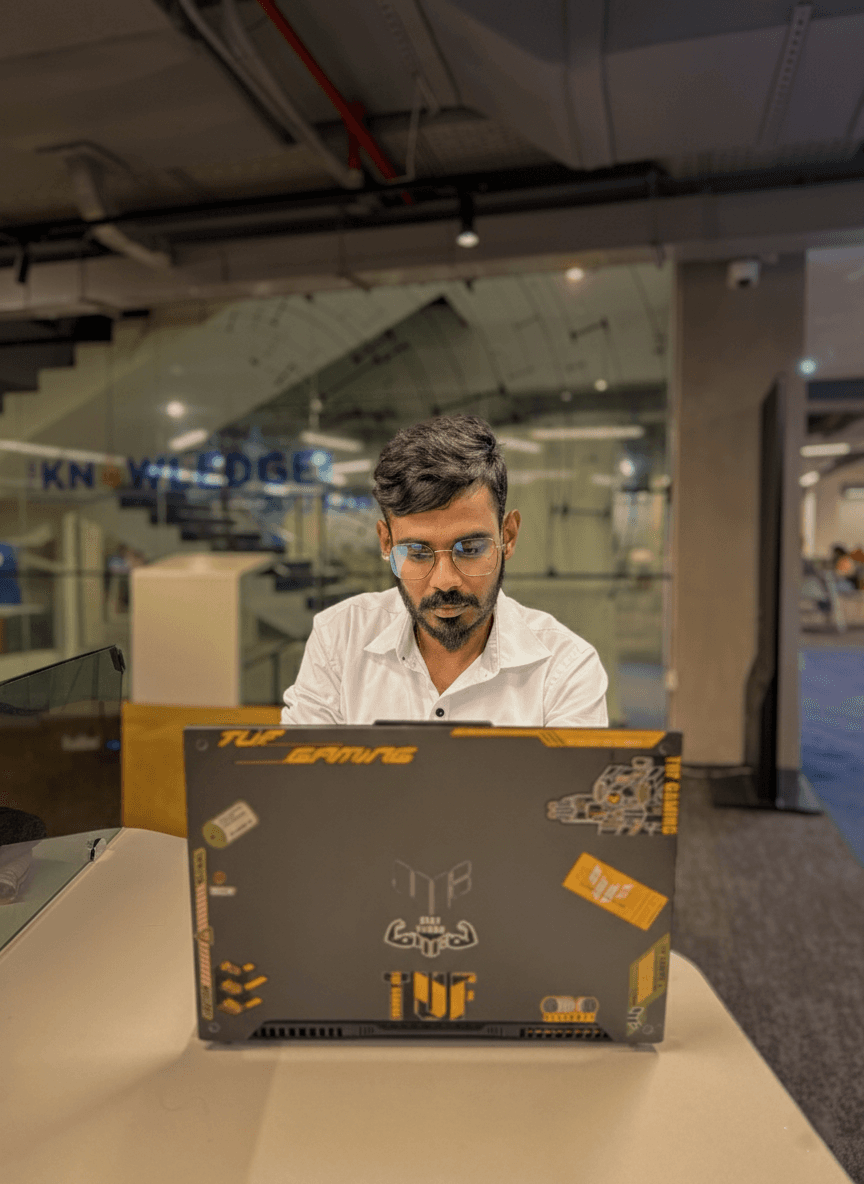 Clerin Balakrishnan working on a laptop